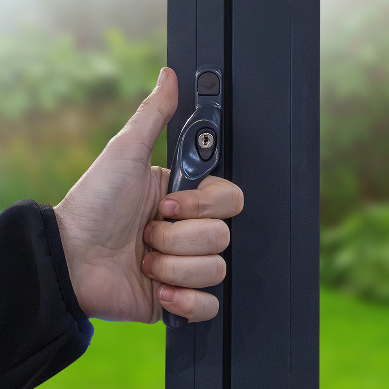 an image showing a hand holding a cranked handle highlighting the larger clearance a cranked handle gives vs an inline one