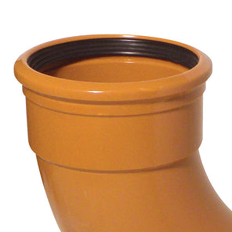 a close up of a terracotta underground pipe showing the inside wall