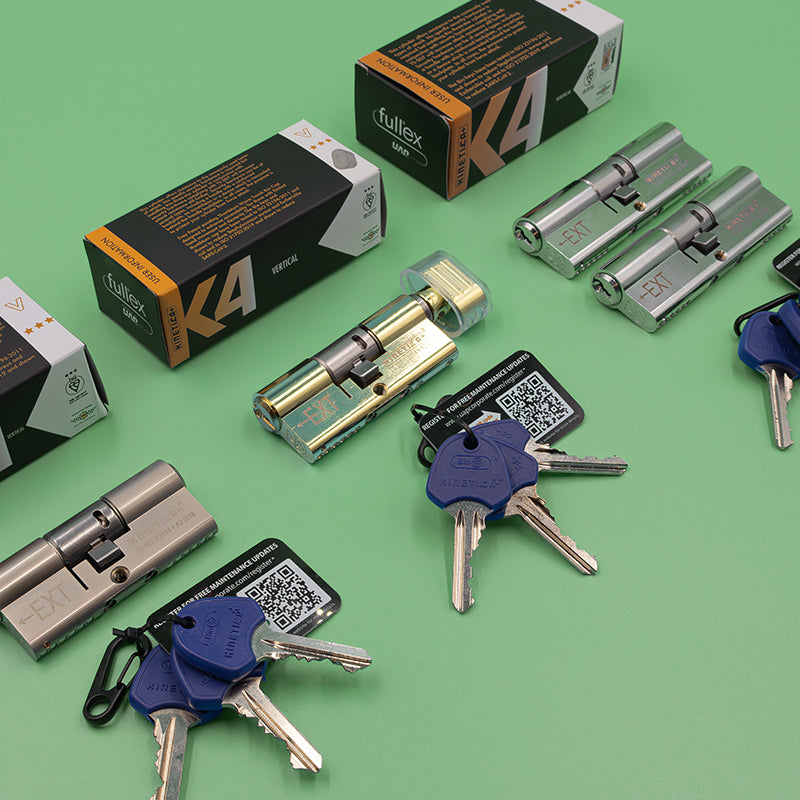 assortment of kinetica euro cylinders arranged on a green background