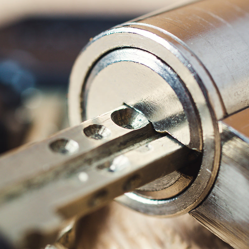 a close up of a key being used in a cylinder